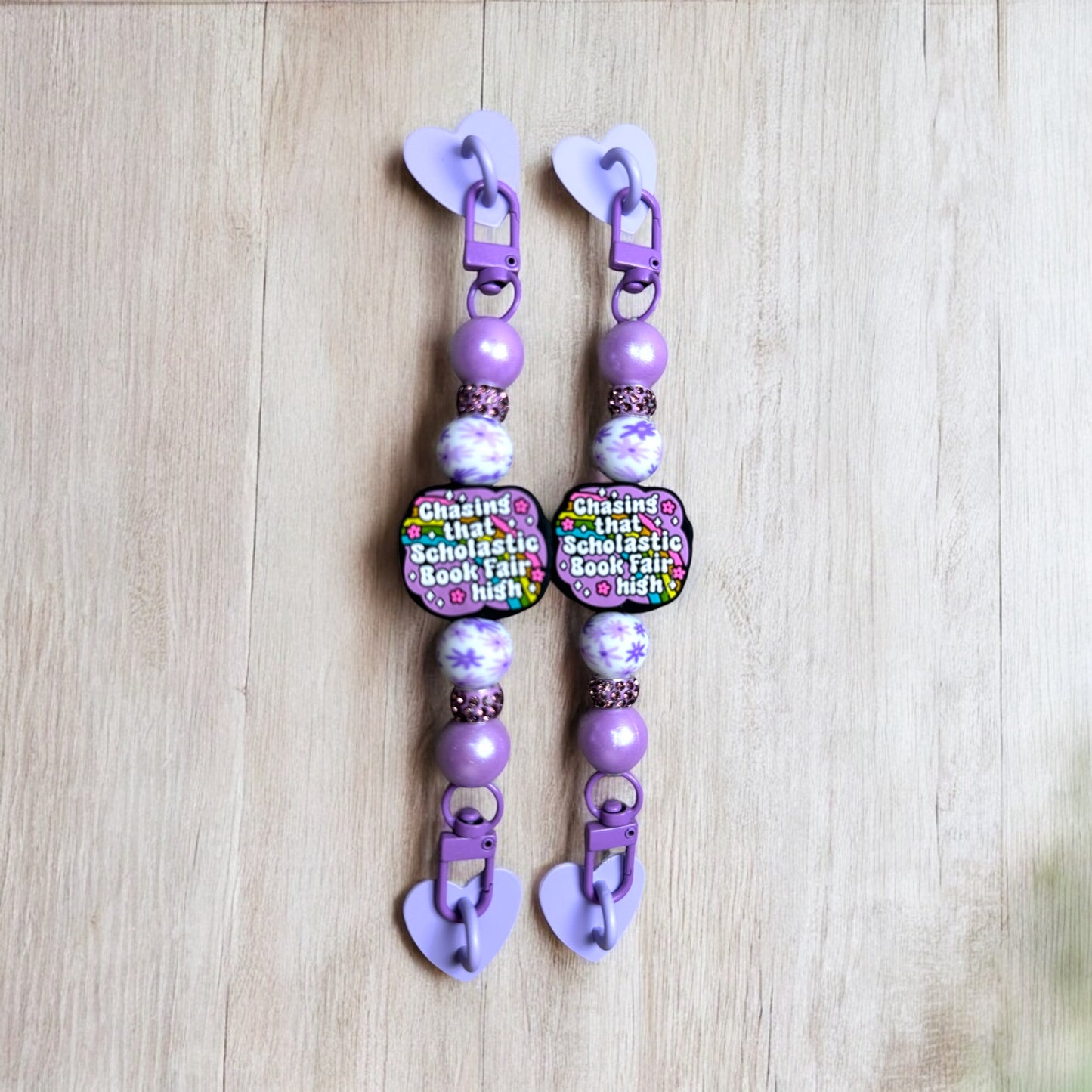 Chasing That Book Fair High E-Reader Strap