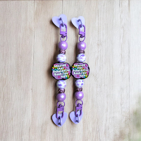Chasing That Book Fair High E-Reader Strap